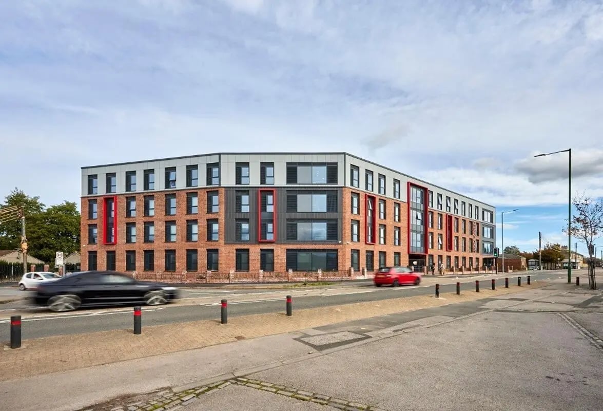 Modern brick building with red accents exterior at Regatta Place in Durham Student Accommodation