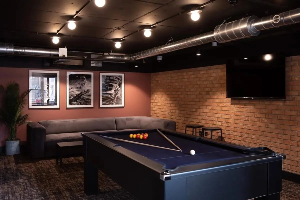 Pool table sofa pictures and TV recreation room at Centre Court in Nottingham Student Accommodation