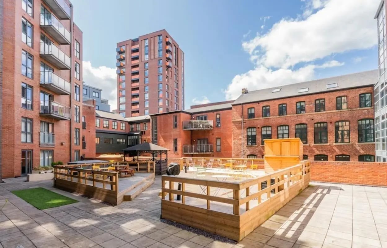 Courtyard with gazebo seating tables and balconies exterior at Cornerhouse in Sheffield Student Accommodation