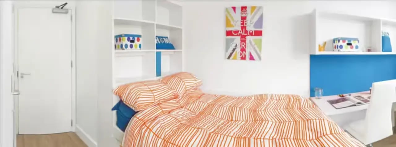 Bed desk shelving and door bedroom at The Colston in Bristol Student Accommodation