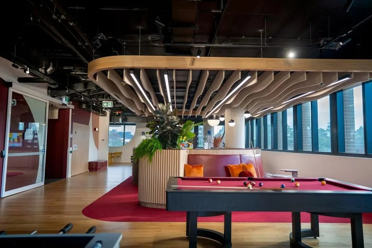 Billiard table with balls and seating lounge area playing area at Scape Kensington in Sydney Student Accommodation