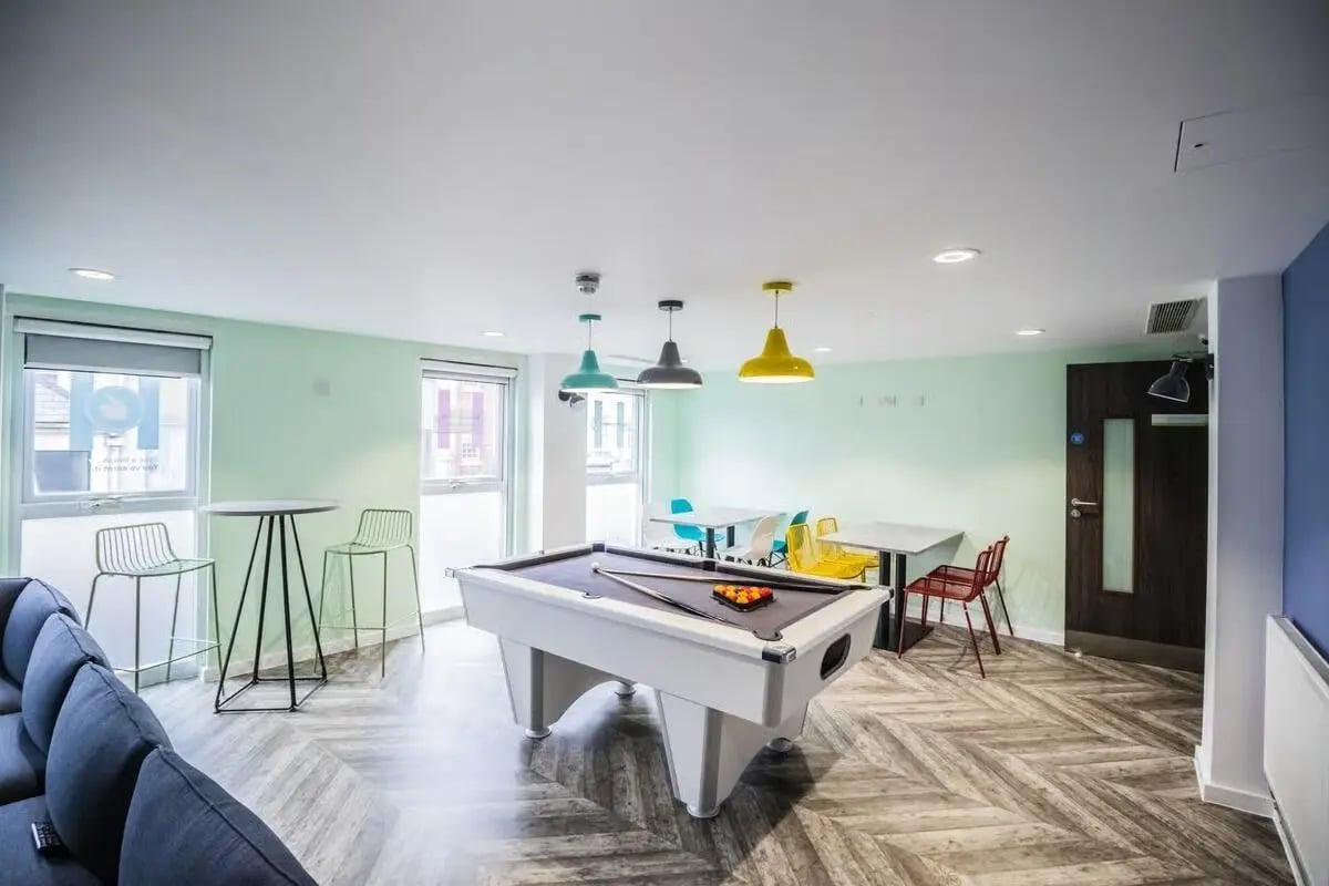 Pool table with tables and chairs communal room at Frobisher House in Plymouth Student Accommodation