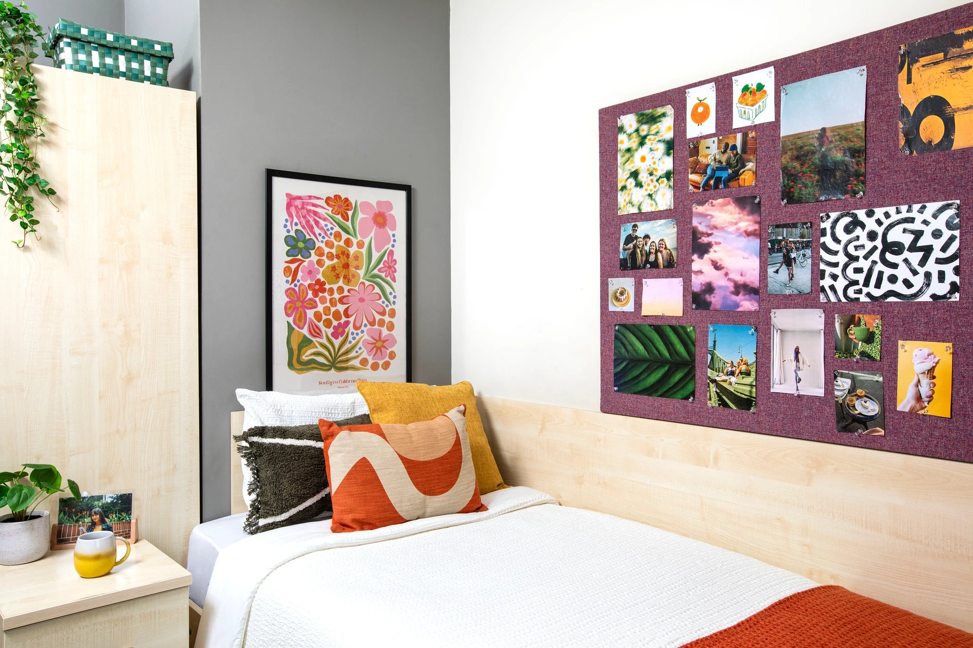 Bed with pillows artwork and photo board bedroom at Purbeck House in Bournemouth Student Accommodation