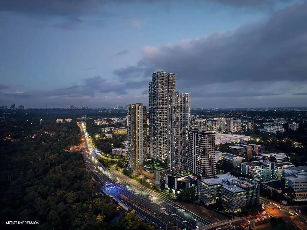Modern apartment buildings along highway exterior at Belong Macquarie in Sydney Student Accommodation
