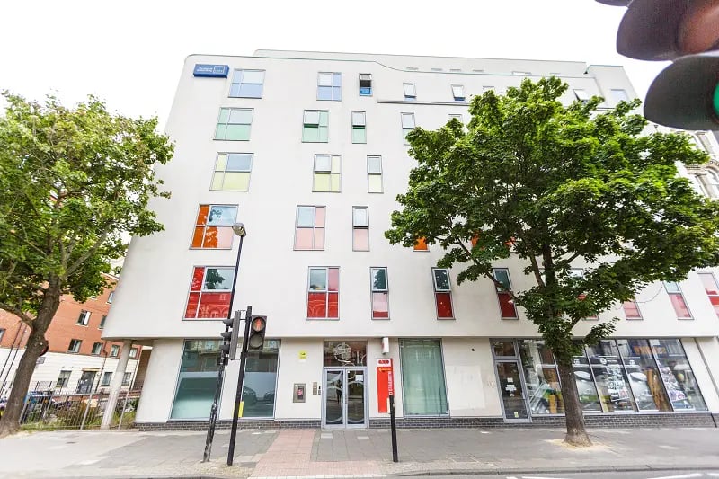 Modern student accommodation building with colorful windows exterior at AXO Islington in London Student Accommodation