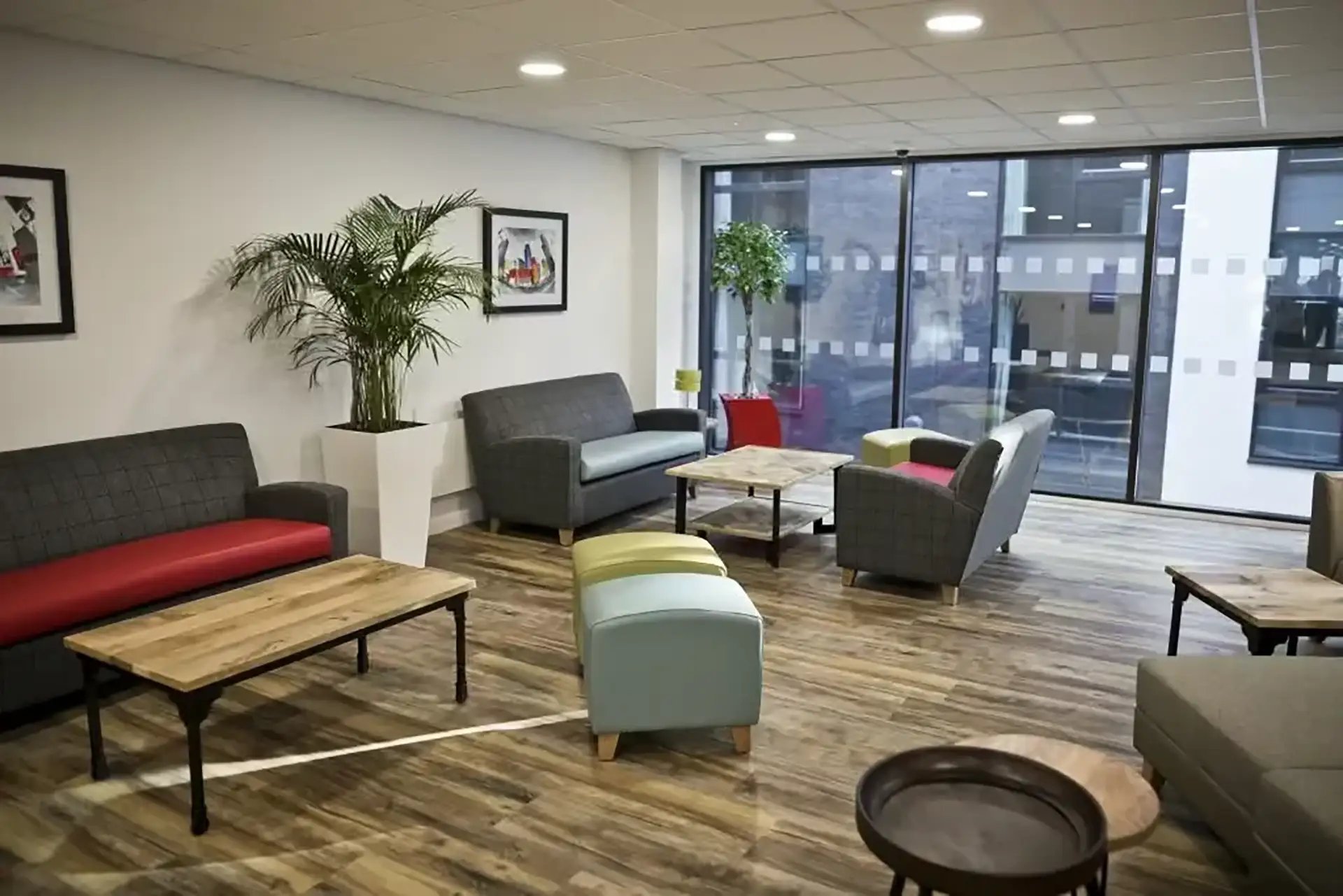 Sofas chairs tables plants communal area living room at Friargate Court in Preston Student Accommodation