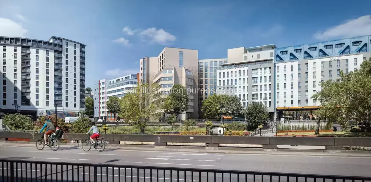 Modern buildings with cyclists on road exterior at The Quarter House in Bristol Student Accommodation