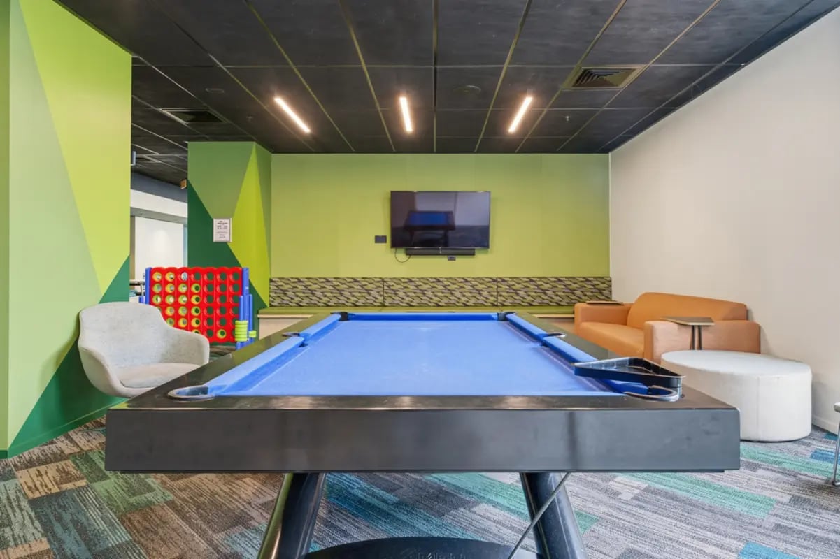Billiard table connect four sofa ottoman living room at Mayoral Drive Student Accommodation in Auckland Student Accommodation
