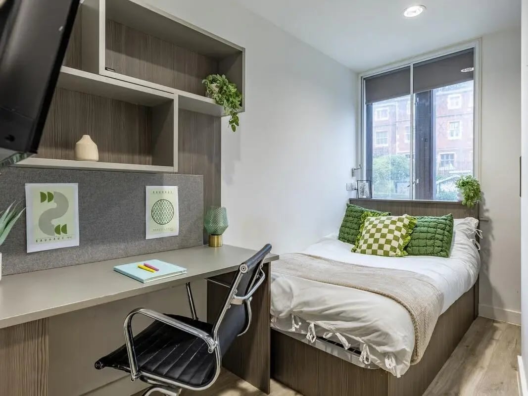 Bed desk shelving chair with artwork bedroom at Centre Gate in Bristol Student Accommodation
