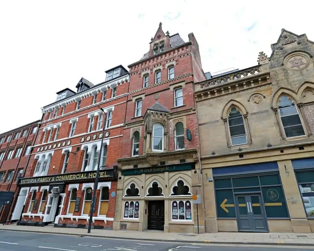 Brick hotel buildings with windows exterior at 26 Great George Street in Leeds Student Accommodation