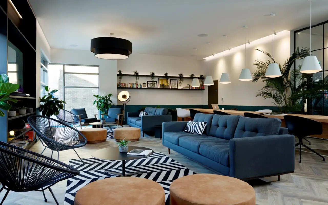 Modern lounge with sofas chairs and tables living room at Student Castle Durham in Durham Student Accommodation
