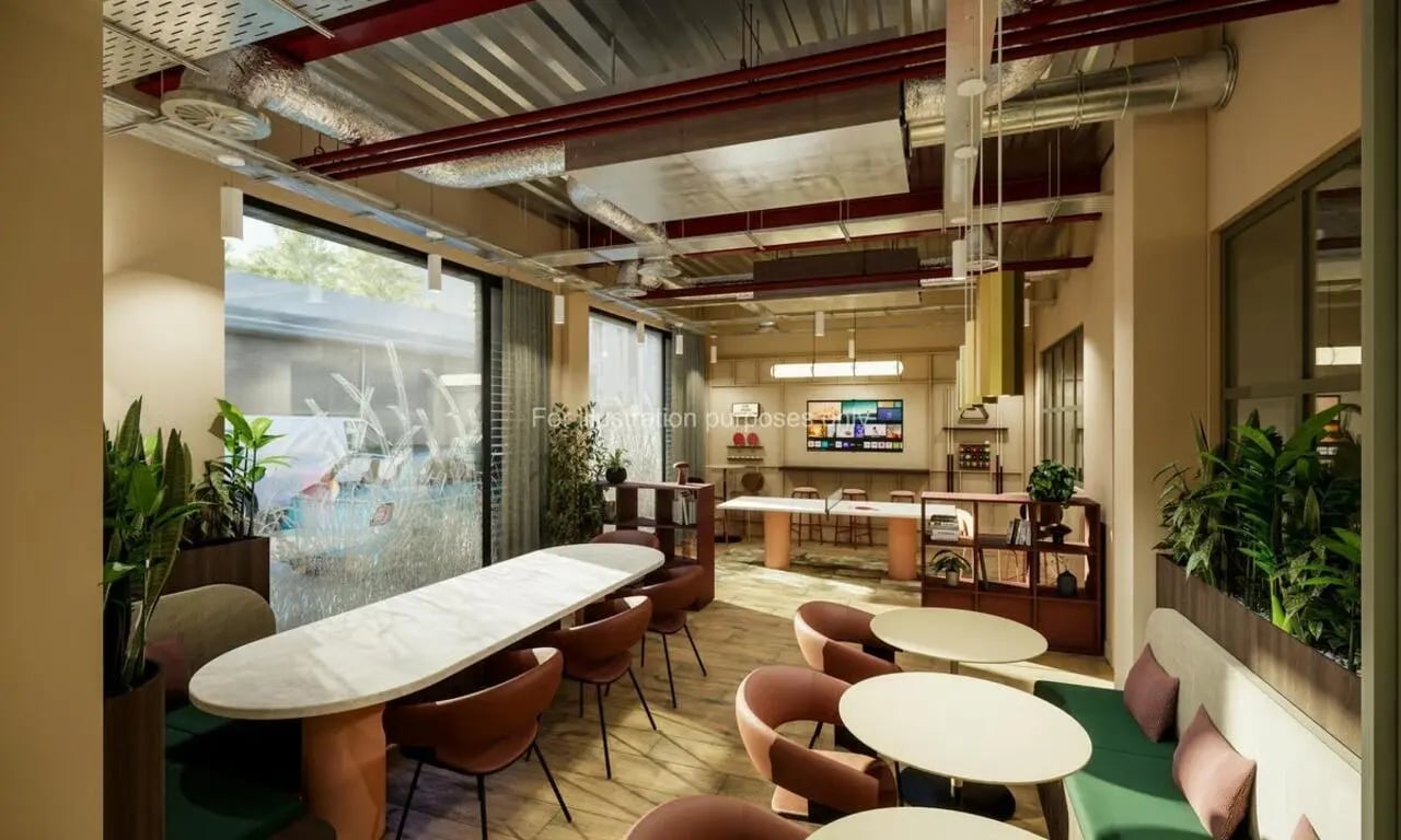 Modern common area with seating tables and TV at Swan Residences in Glasgow Student Accommodation