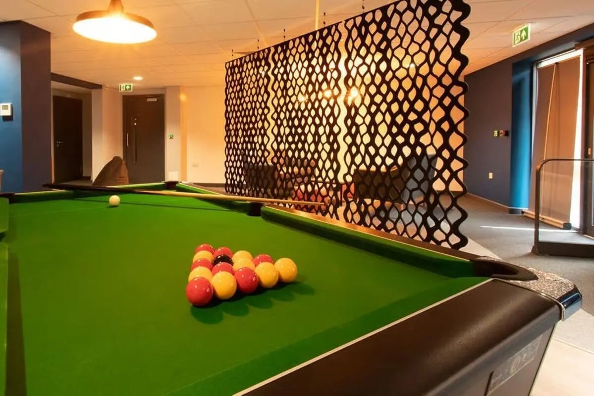 Billiard balls on green felt table playing area at Abode York in York Student Accommodation