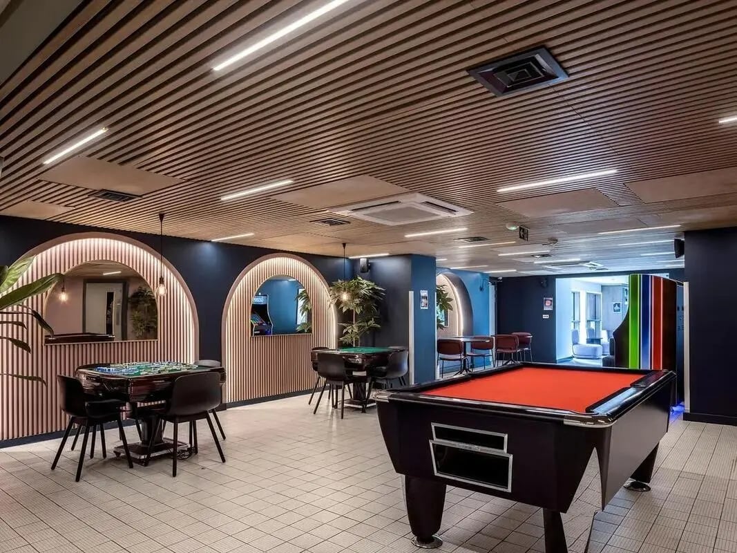 Pool table gaming tables and chairs recreation room at COSMOS in Sheffield Student Accommodation