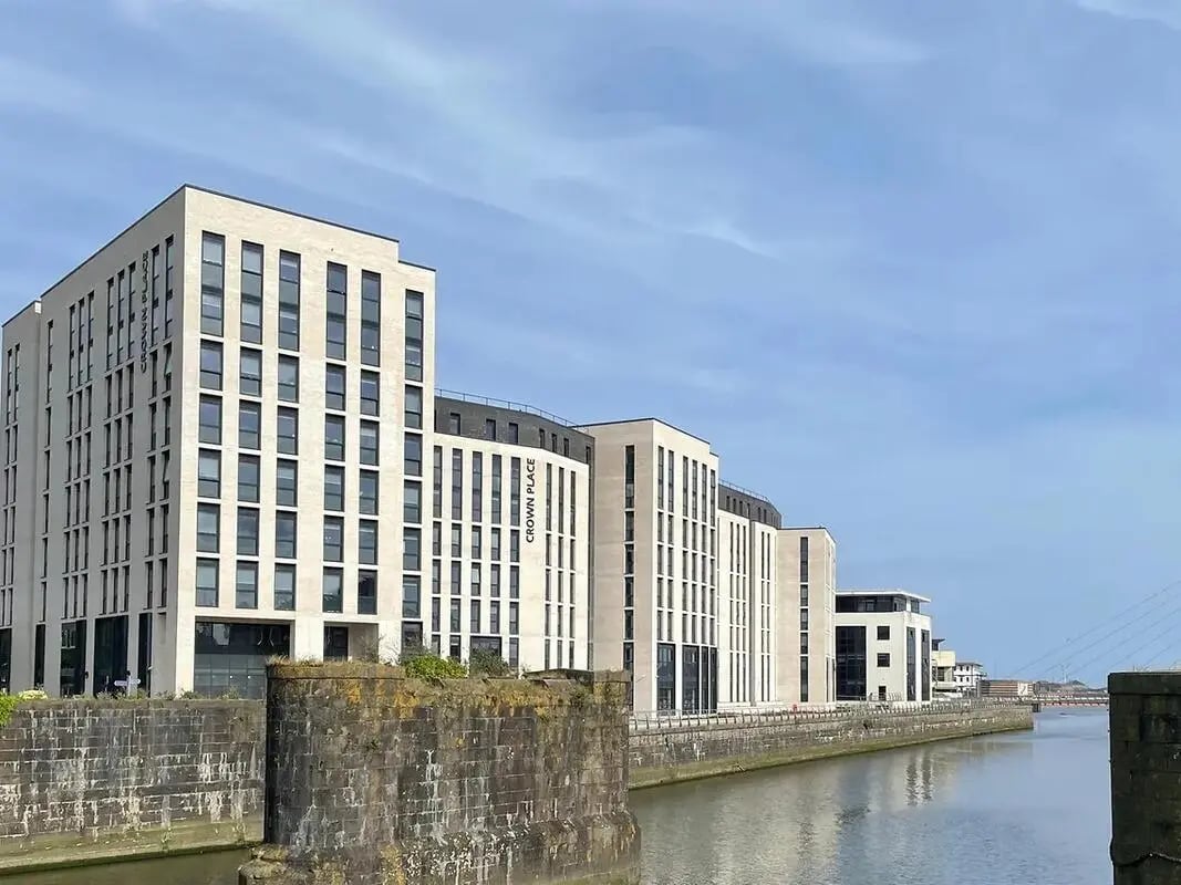 Modern apartment buildings along water exterior at Crown Place Swansea in Swansea Student Accommodation
