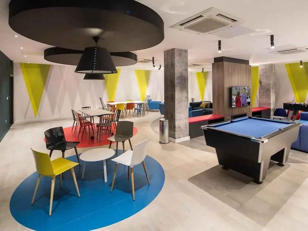 Pool table sofas tables chairs communal area at Grand Felda House in Wembley Student Accommodation