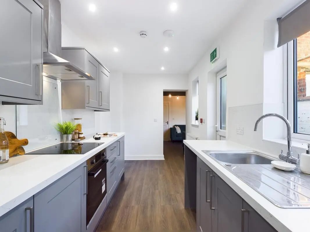 Modern grey kitchen with oven sink and cabinets kitchen at 6 Bedroom House at 53, Ripon Street in Lincoln Student Accommodation