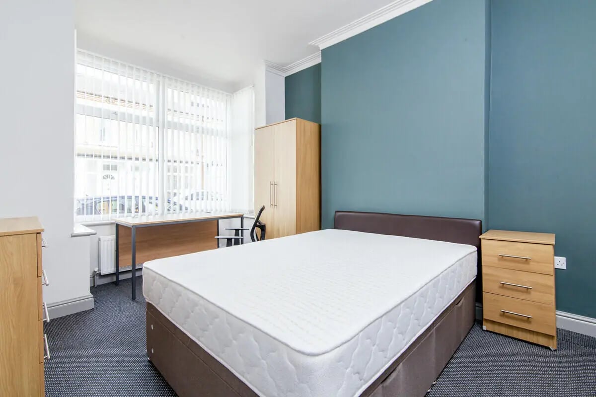 Bed dresser wardrobe desk study area bedroom at 3 Bedroom House at 8, Haddon Street in Salford Student Accommodation