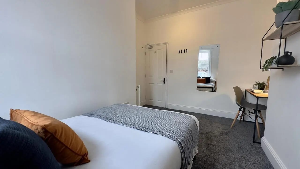 Bed desk mirror and door bedroom at 6 Bedroom House at 214, West Parade in Lincoln Student Accommodation