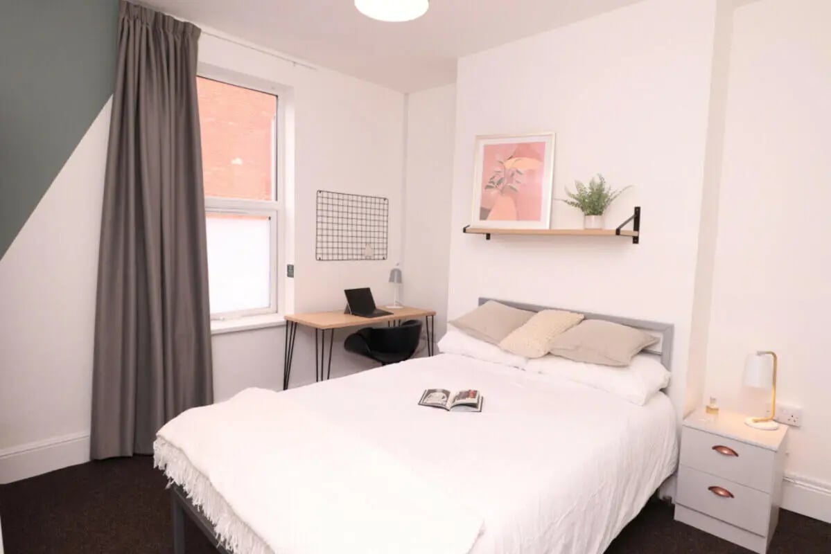 Bed desk shelf artwork and plant bedroom at 4 Bedroom House at 86, Cross Street in Lincoln Student Accommodation