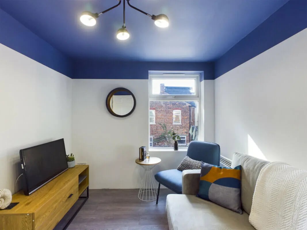Modern living room with sofa chair television living room at 4 Bedroom House at Flat 1 30, Haydn Avenue in Manchester Student Accommodation