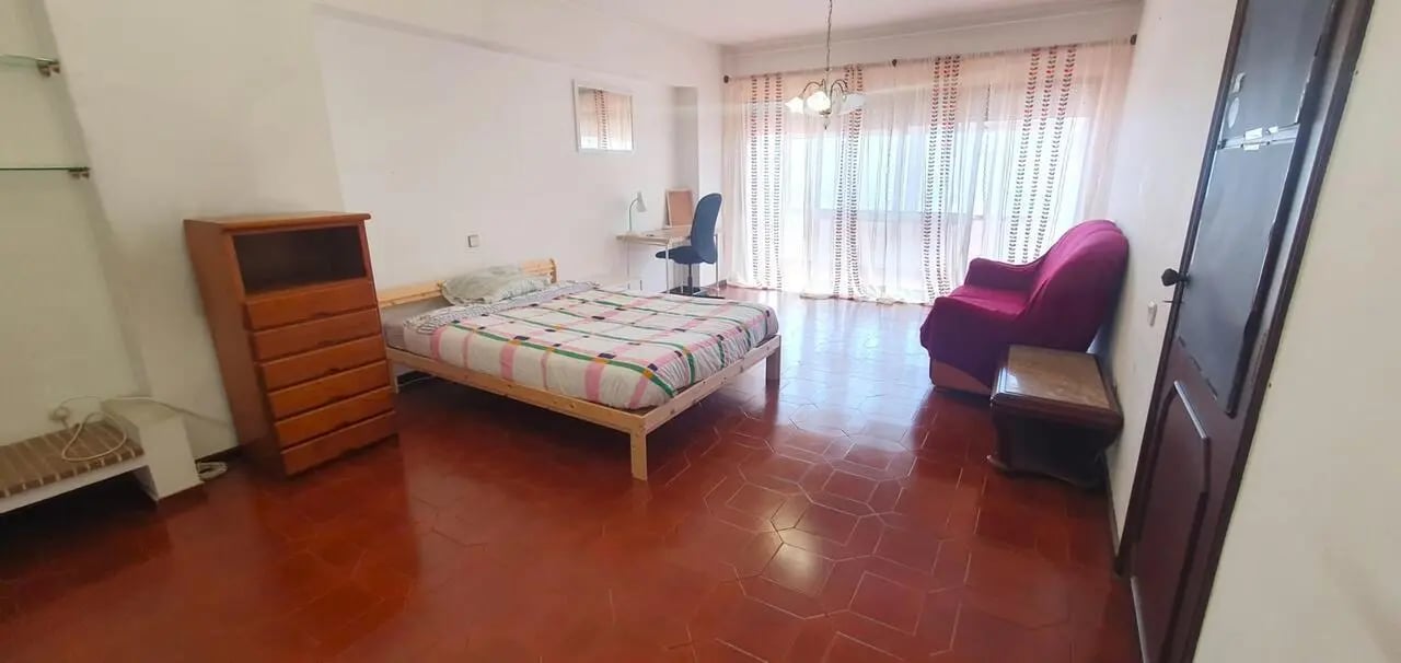 Bed dresser desk chair couch living room. at Double Bedroom close to Minho University 1 in Guimaraes Student Accommodation