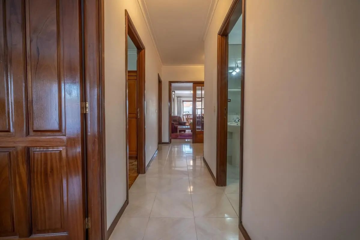 Interior hallway with doors and distant living area Interior at Appealing 3-bedroom flat in Esposende in Esposende Student Accommodation