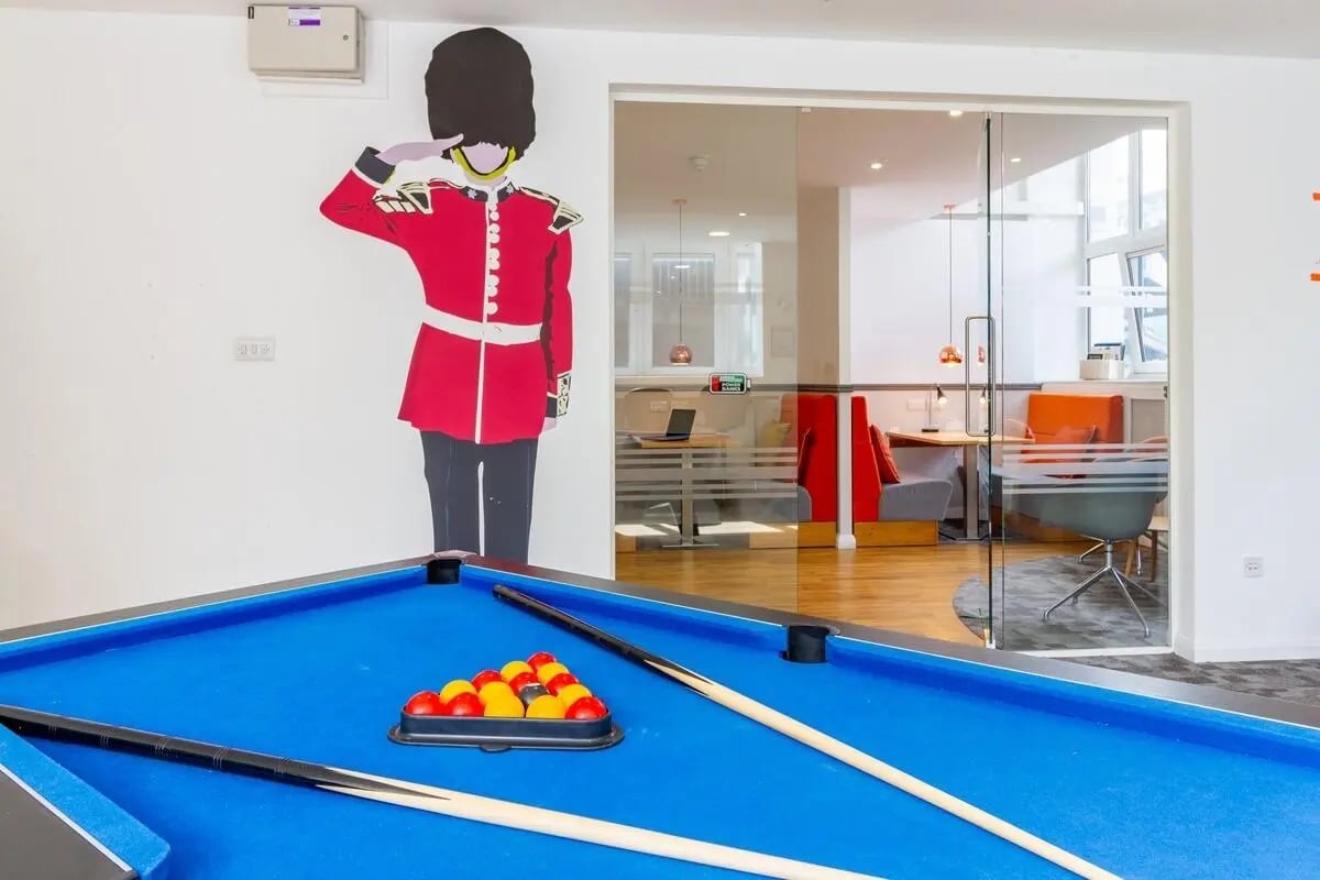 Billiard table with cue sticks and balls playing area at Portobello Garrow House in London Student Accommodation