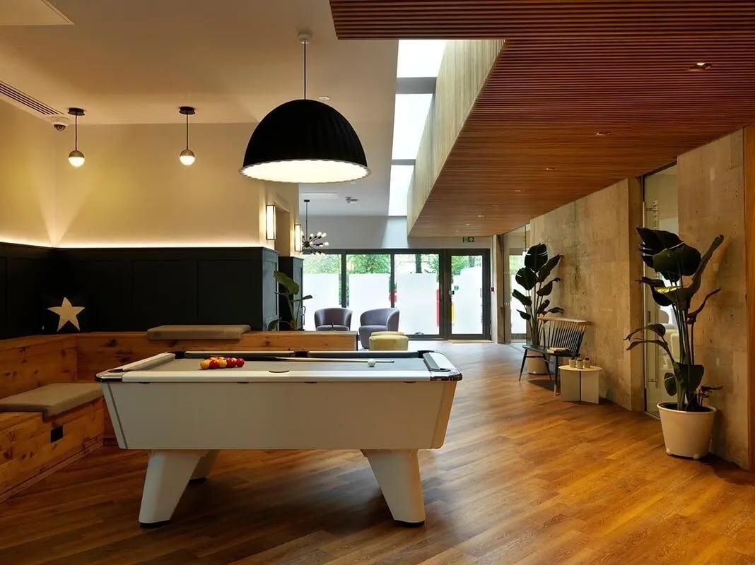 Pool table with balls and bench living room at Heald Court in Manchester Student Accommodation
