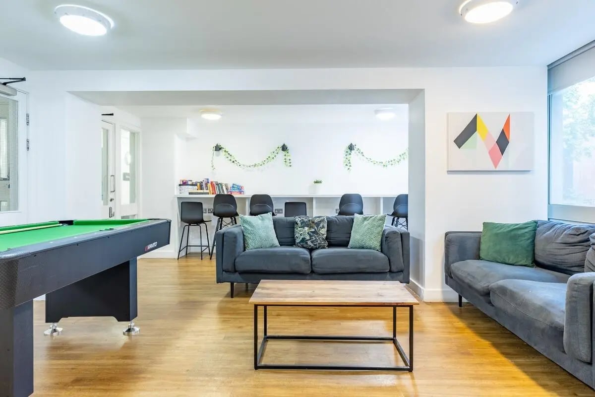 Pool table sofas coffee table communal lounge at Chelsea Lightfoot Hall in London Student Accommodation