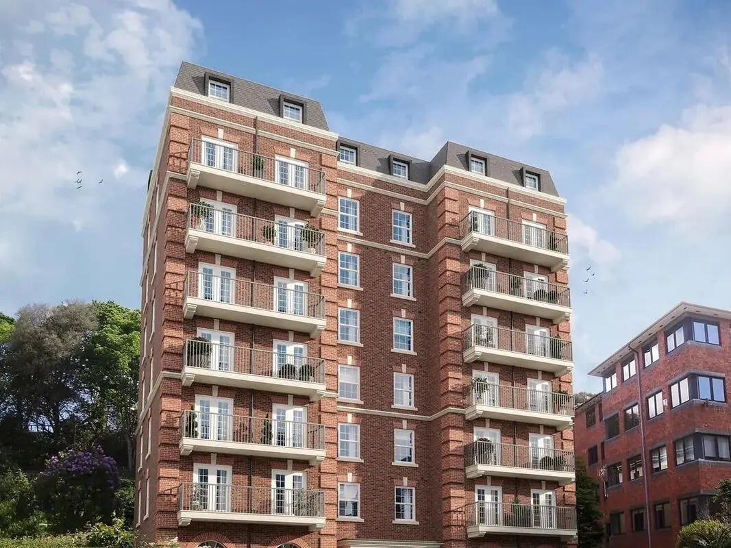 Brick apartment building with multiple balconies exterior at Yugo Rothesay House in Bournemouth Student Accommodation