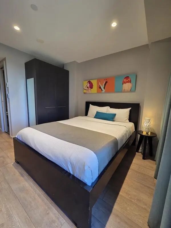 Bed wardrobe and artwork bedroom at Sydney Student Living Top Ryde in Sydney Student Accommodation