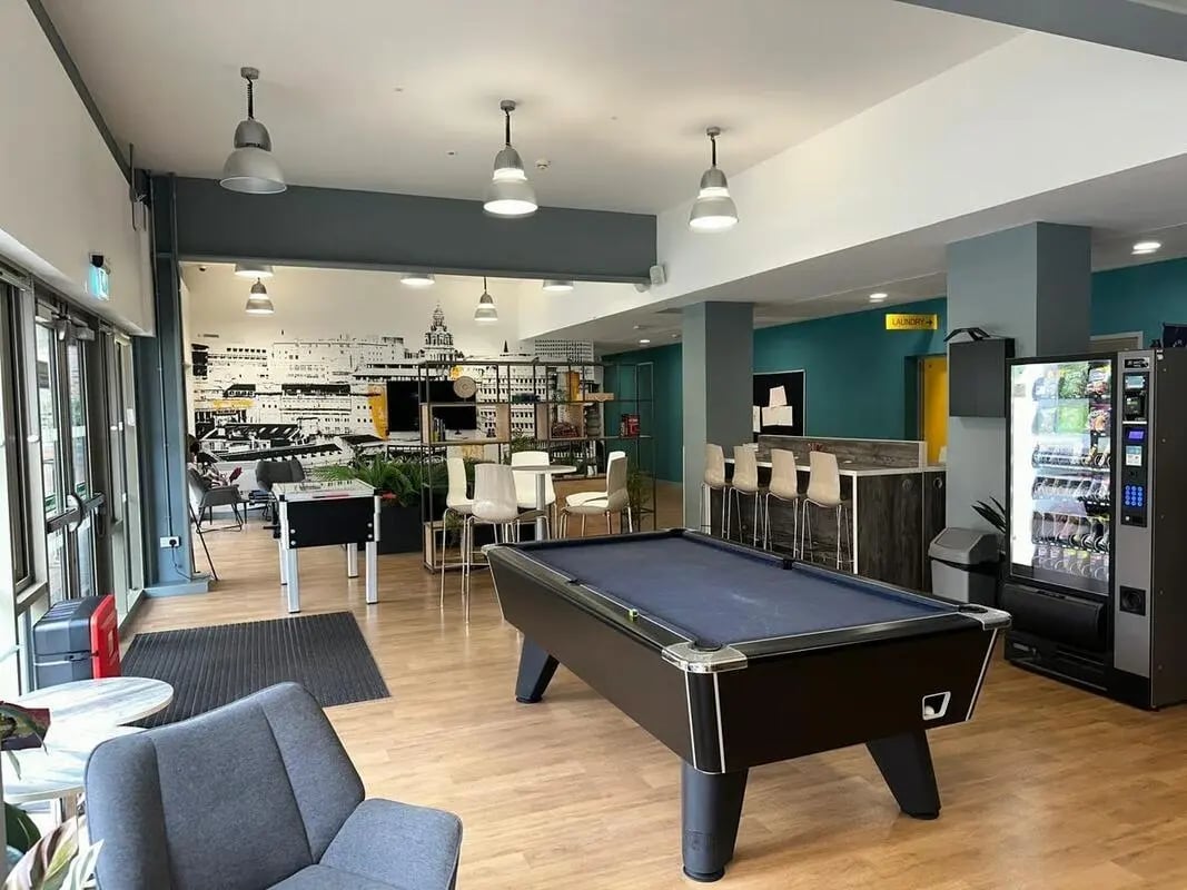 Pool table foosball table bar vending machine common area at Foundry Courtyard in Glasgow Student Accommodation