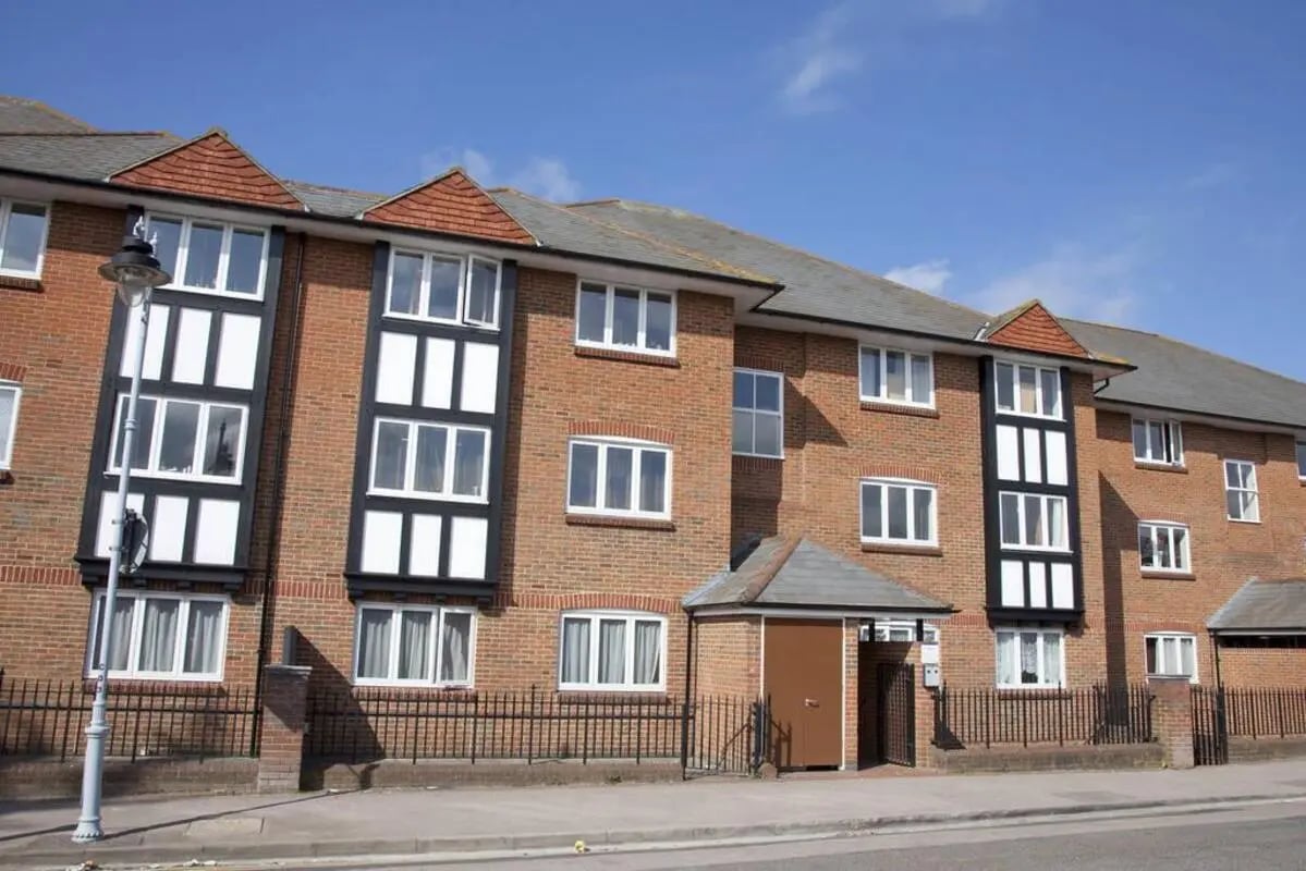Brick student accommodation building with many windows Exterior at Pin Hill in Canterbury Student Accommodation