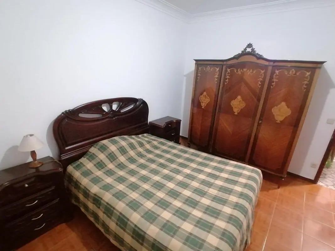 Bed nightstand wardrobe bedroom at Cozy Double Bedroom close to Custóias Metro in Matosinhos Student Accommodation