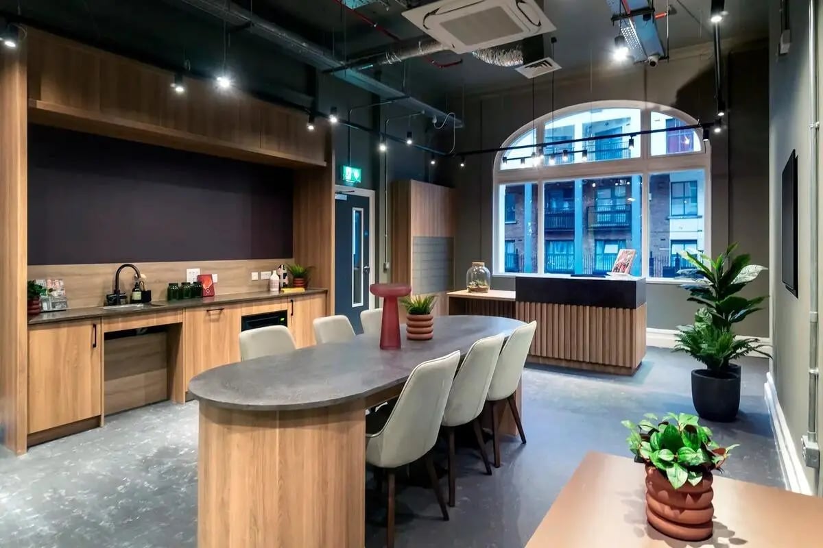 Kitchen island with chairs and reception area at The Artisan in Dublin Student Accommodation