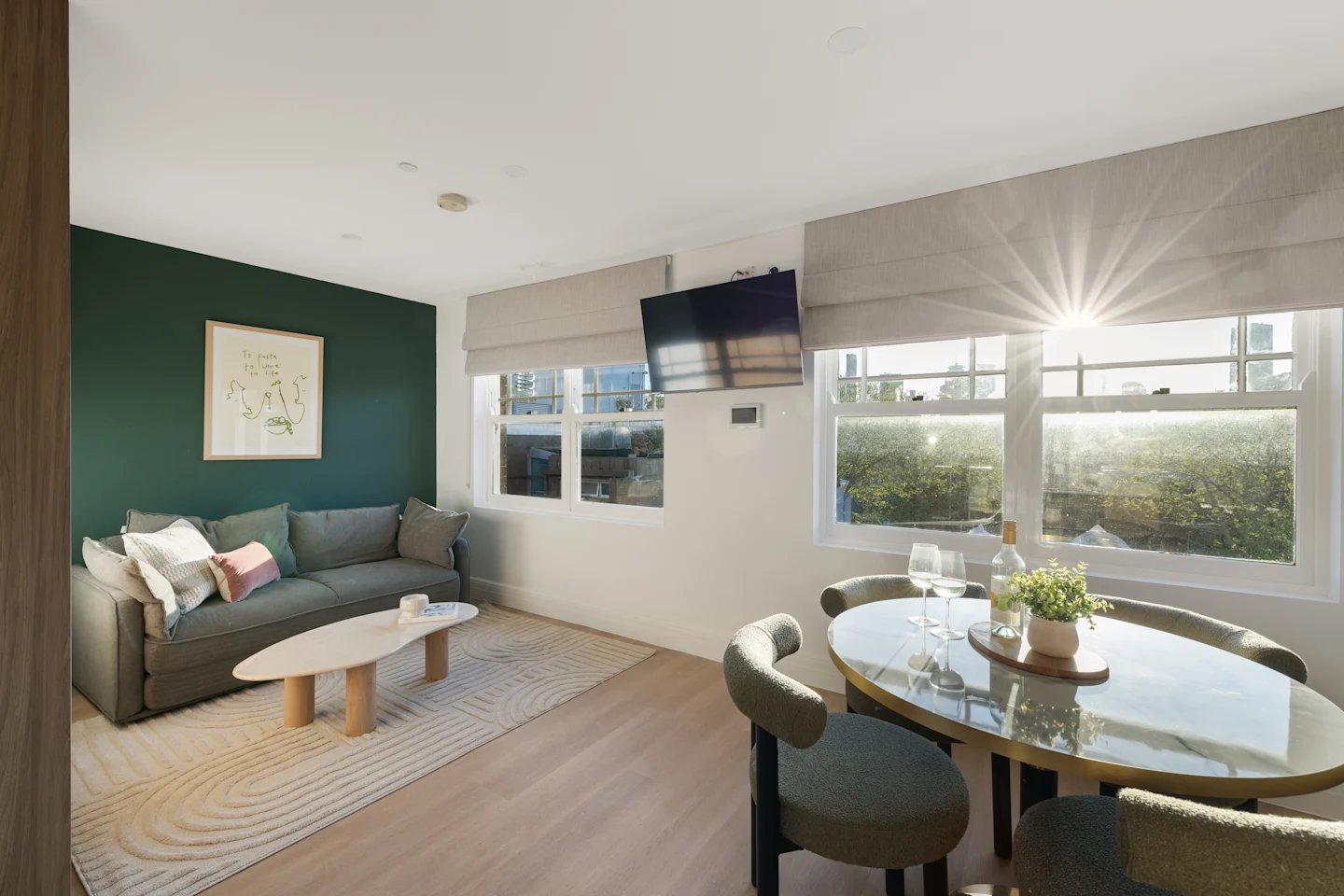 Sofa coffee table dining table living area at UKO Potts Point in Sydney Student Accommodation