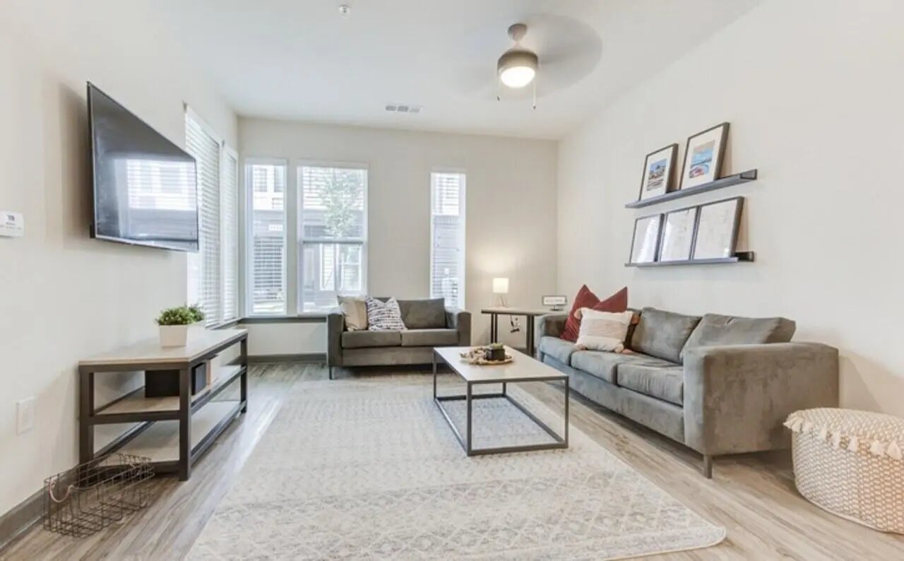 Modern living room with sofas coffee table living room at The Row At The Stadium in Columbia Student Accommodation