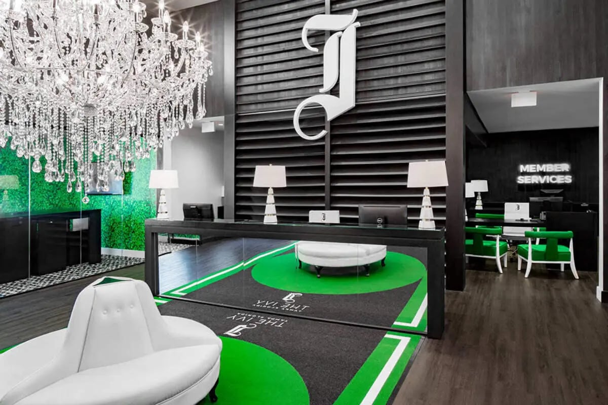 Modern reception area with sofas and reception desk at The Ivy in Tampa Student Accommodation