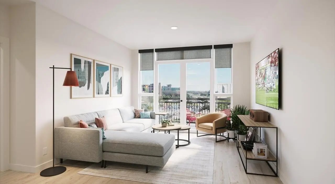 Modern living room with sectional sofa artwork and TV living room at Aspire Reserve in College Station Student Accommodation