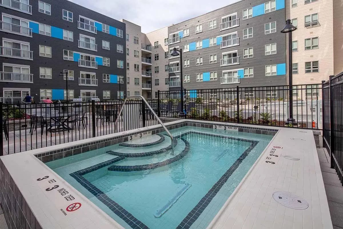 Jacuzzi with steps and railings building exterior at Theory Syracuse in Syracuse Student Accommodation