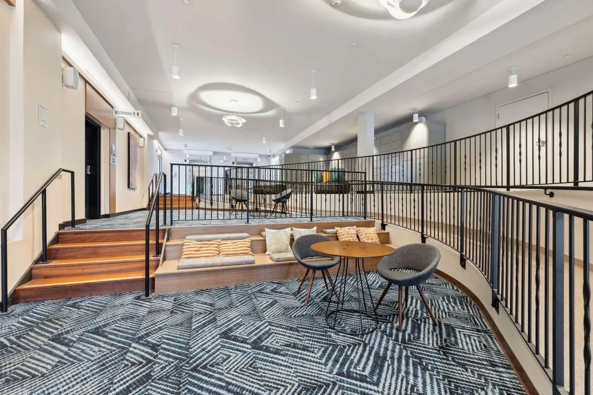 Tiered seating with chairs and table lounge area at The Valley Apartments & Townhomes in State College Student Accommodation