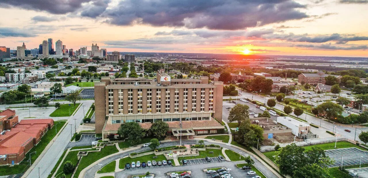 Brick building with many windows campus exterior at Century Towers Apartments in Kansas City Student Accommodation