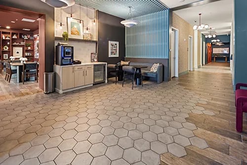 Coffee maker seating area and hallway common area at Uncommon Columbus in Columbus Student Accommodation