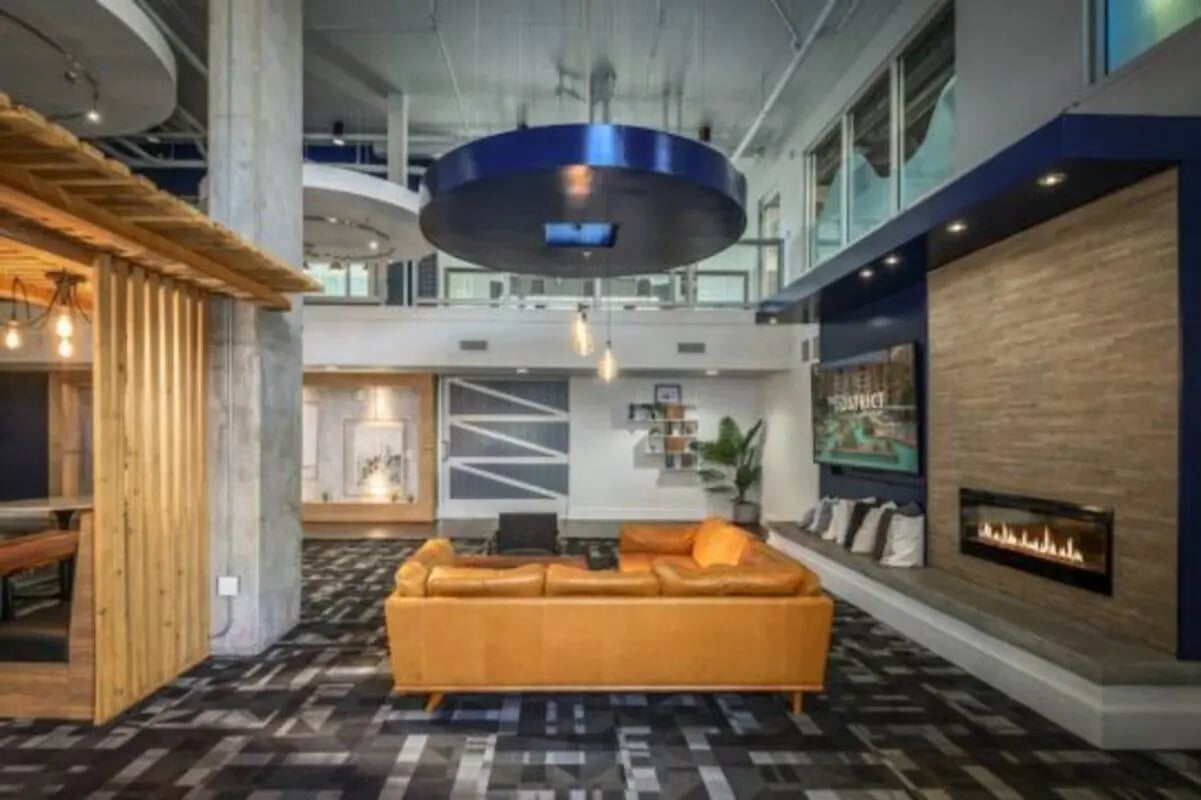 Sofa fireplace and TV living room at The District on Apache in Tempe Student Accommodation