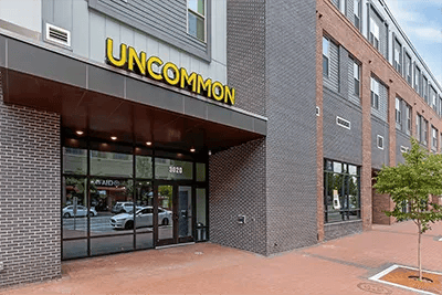 Uncommon building entrance with modern exterior and entrance exterior at Uncommon Raleigh in Raleigh Student Accommodation