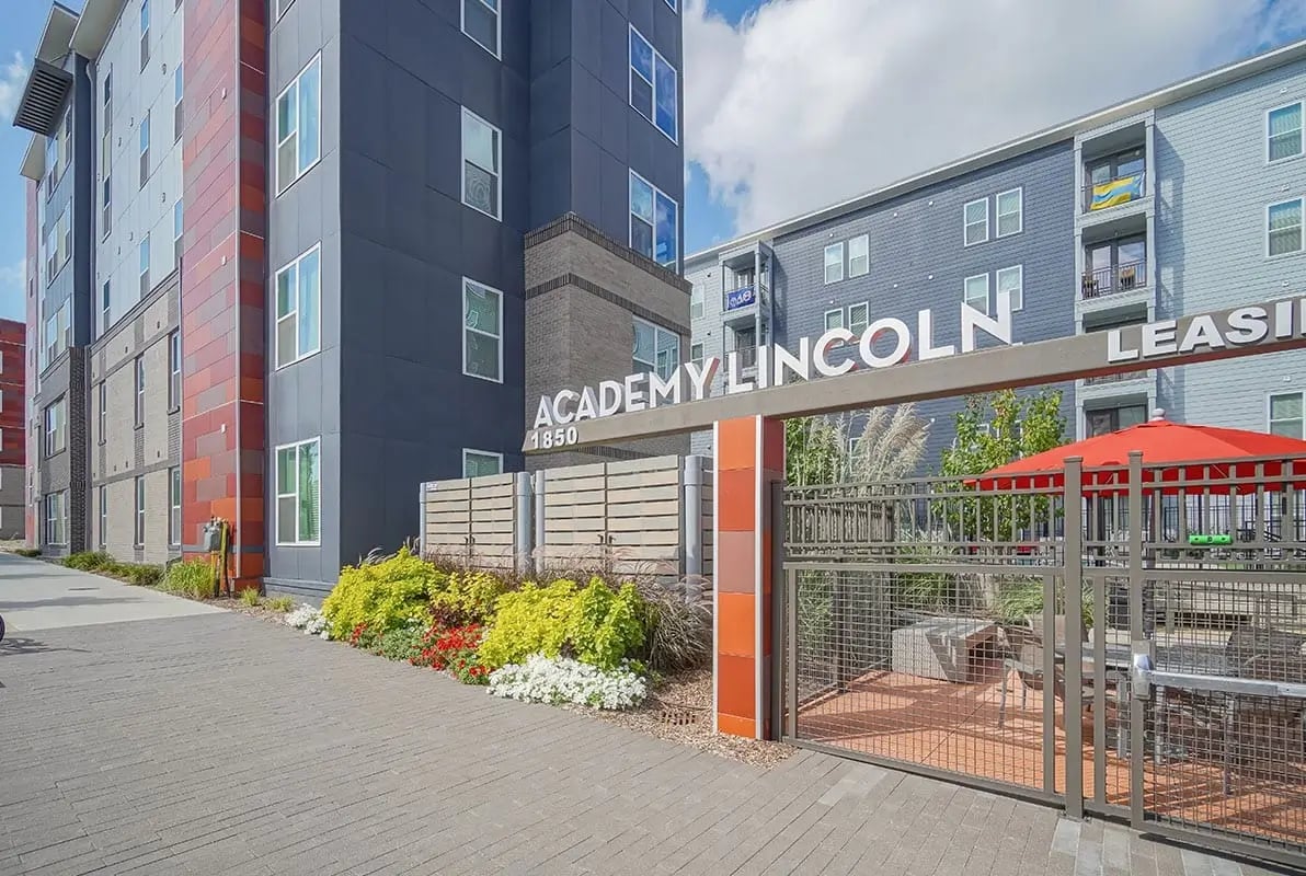 Academy Lincoln sign outdoor seating area exterior at Academy in Lincoln Student Accommodation