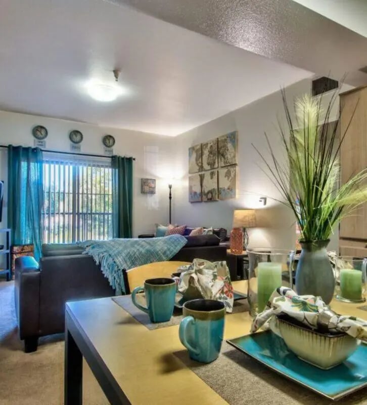 Dining table with mugs and serving bowl living room at GrandMarc at University Village in Riverside Student Accommodation