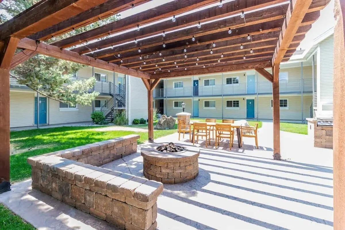 Fire pit pergola seating outdoor grill exterior at Alpine Chalet in Rexburg Student Accommodation