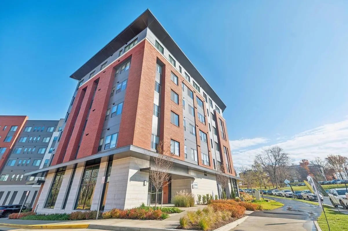 Modern apartment building with brick exterior exterior at The Main on University in Fairfax Student Accommodation